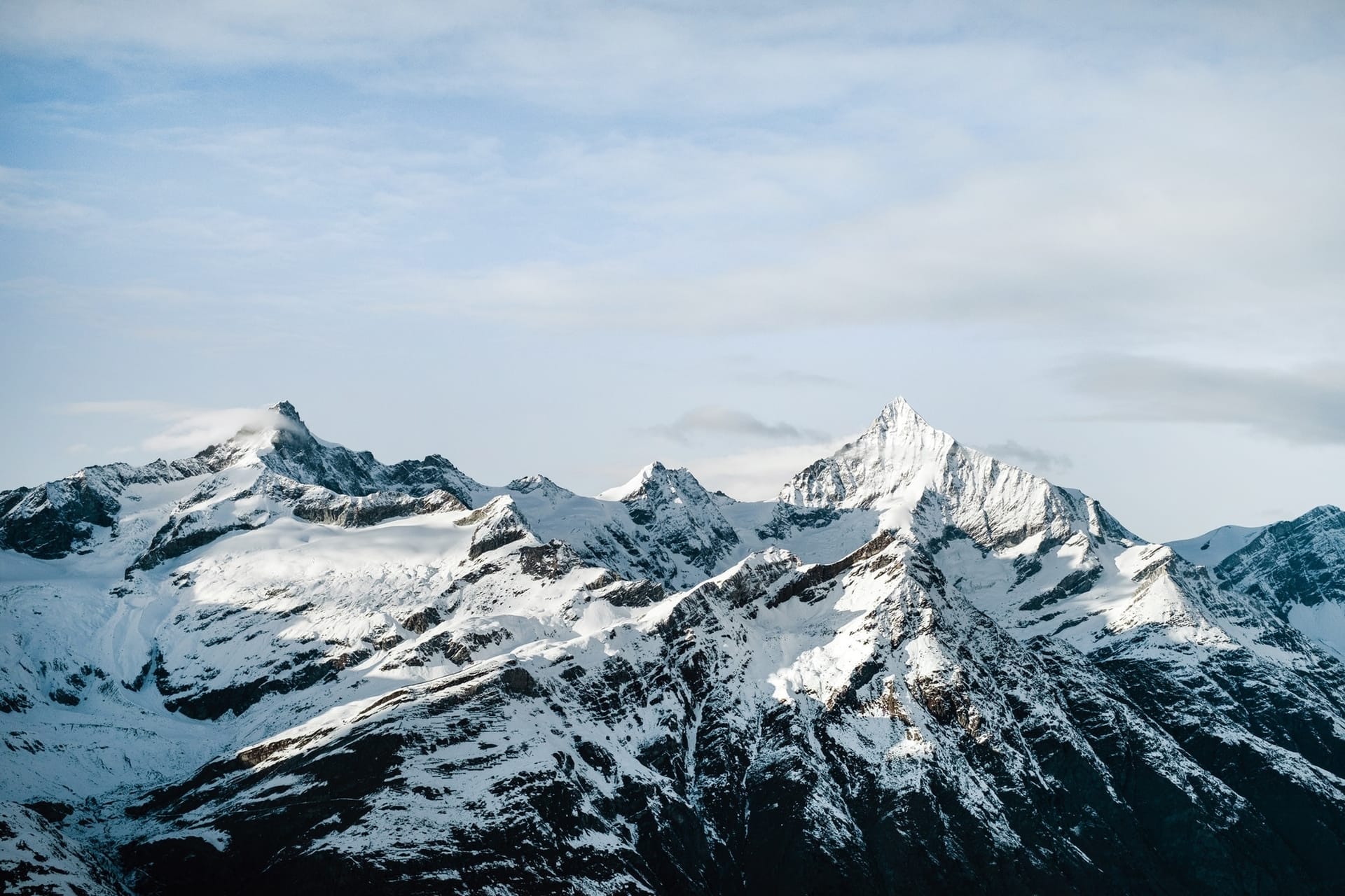 Rocky mountain ridge with snow-covered tops